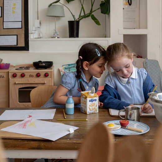 Elmhurst school two girls drawing together